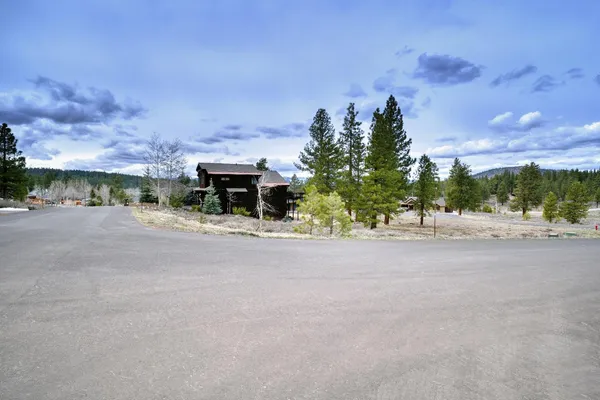 a view of a road with a building in the background