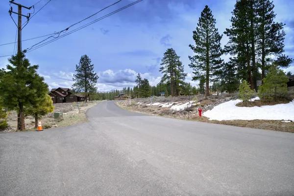 a view of a road with a yard