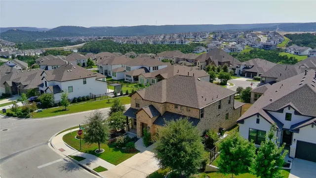 an aerial view of a house with a garden