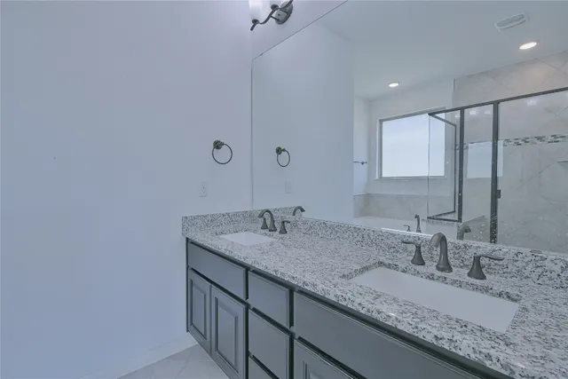 a bathroom with a bathtub and a shower