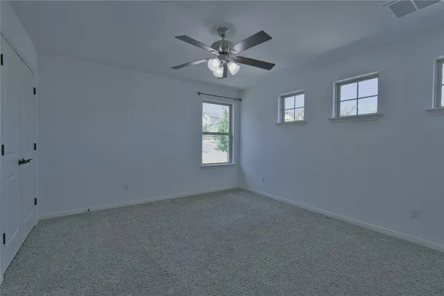 a view of entryway and hall with a fan