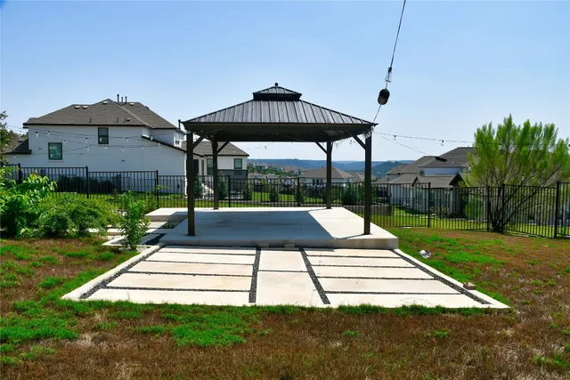 a view of a table and chairs under an umbrella