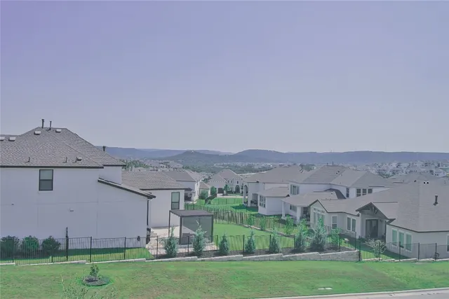 a swimming pool with outdoor seating and yard