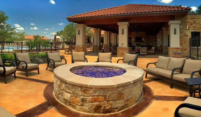 a view of a swimming pool with a patio and a garden