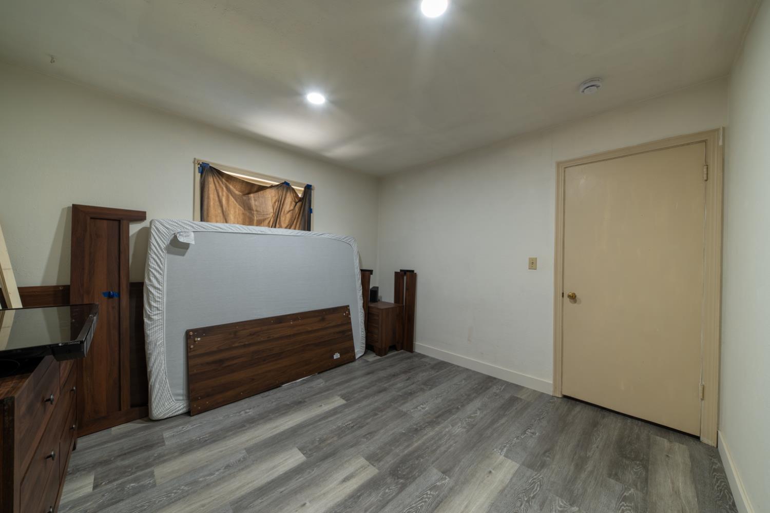 1004 West Pontiac Way Fresno, CA 93705 - Photo 18 of 34 a view of room with wooden floor