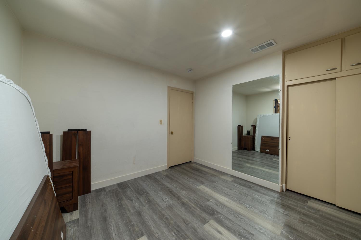 1004 West Pontiac Way Fresno, CA 93705 - Photo 19 of 34 wooden floor in an empty room