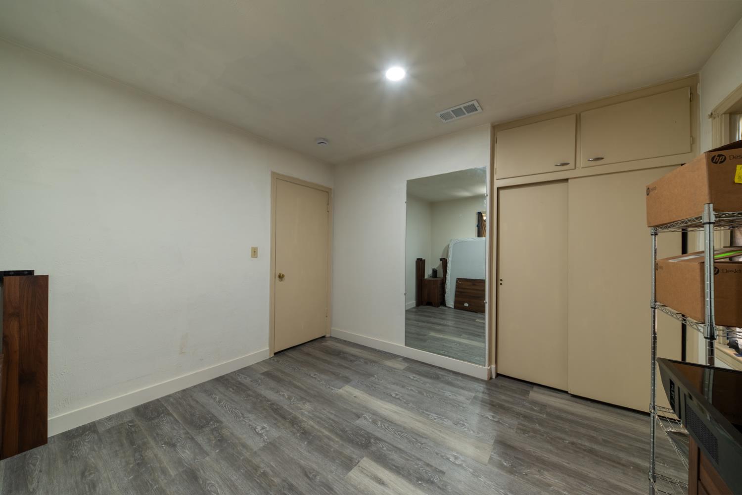 1004 West Pontiac Way Fresno, CA 93705 - Photo 20 of 34 a view of empty room with wooden floor