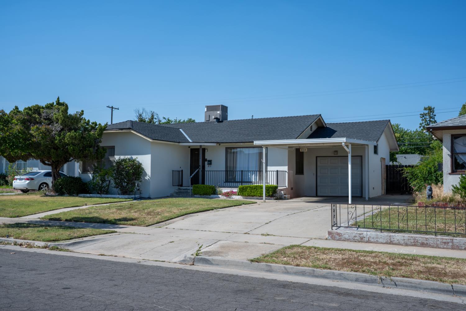 1004 West Pontiac Way Fresno, CA 93705 - Photo 2 of 34 front view of a house with a yard