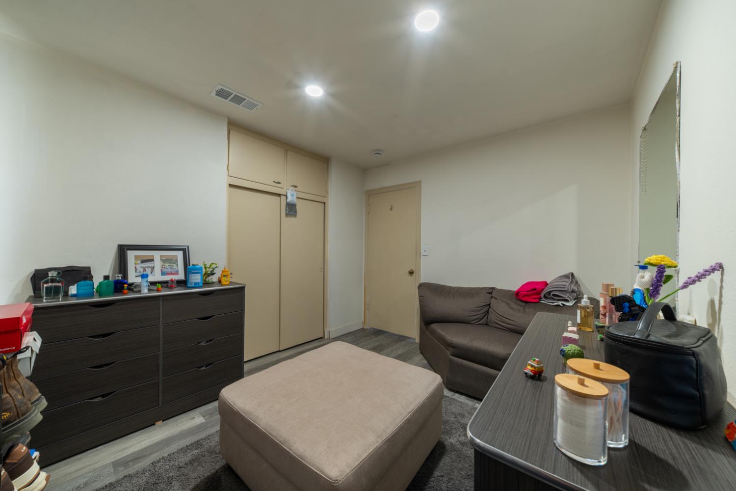 1004 West Pontiac Way Fresno, CA 93705 - Photo 22 of 34 a living room with furniture and wooden floor