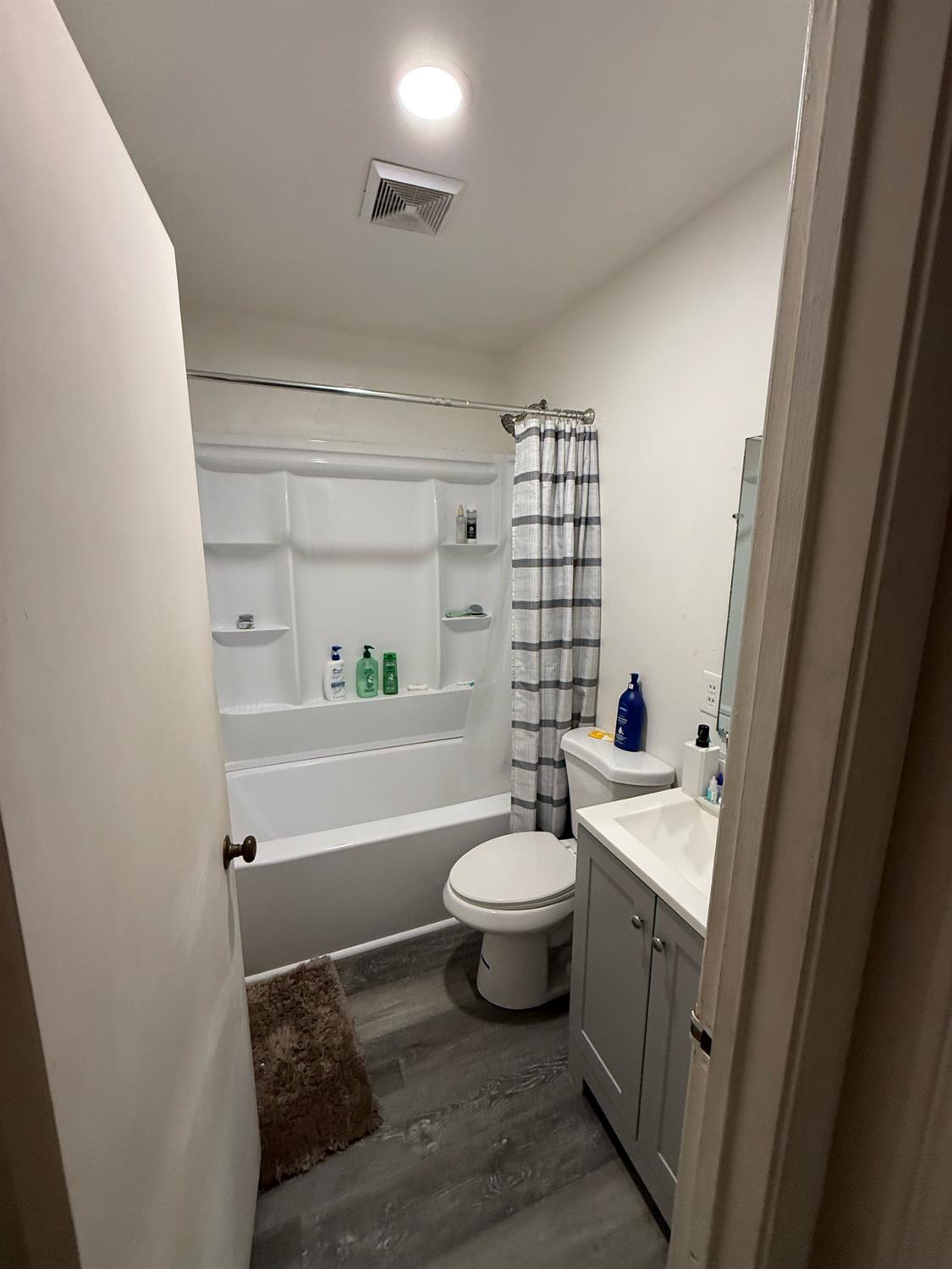 1004 West Pontiac Way Fresno, CA 93705 - Photo 25 of 34 a bathroom with a sink a toilet and shower