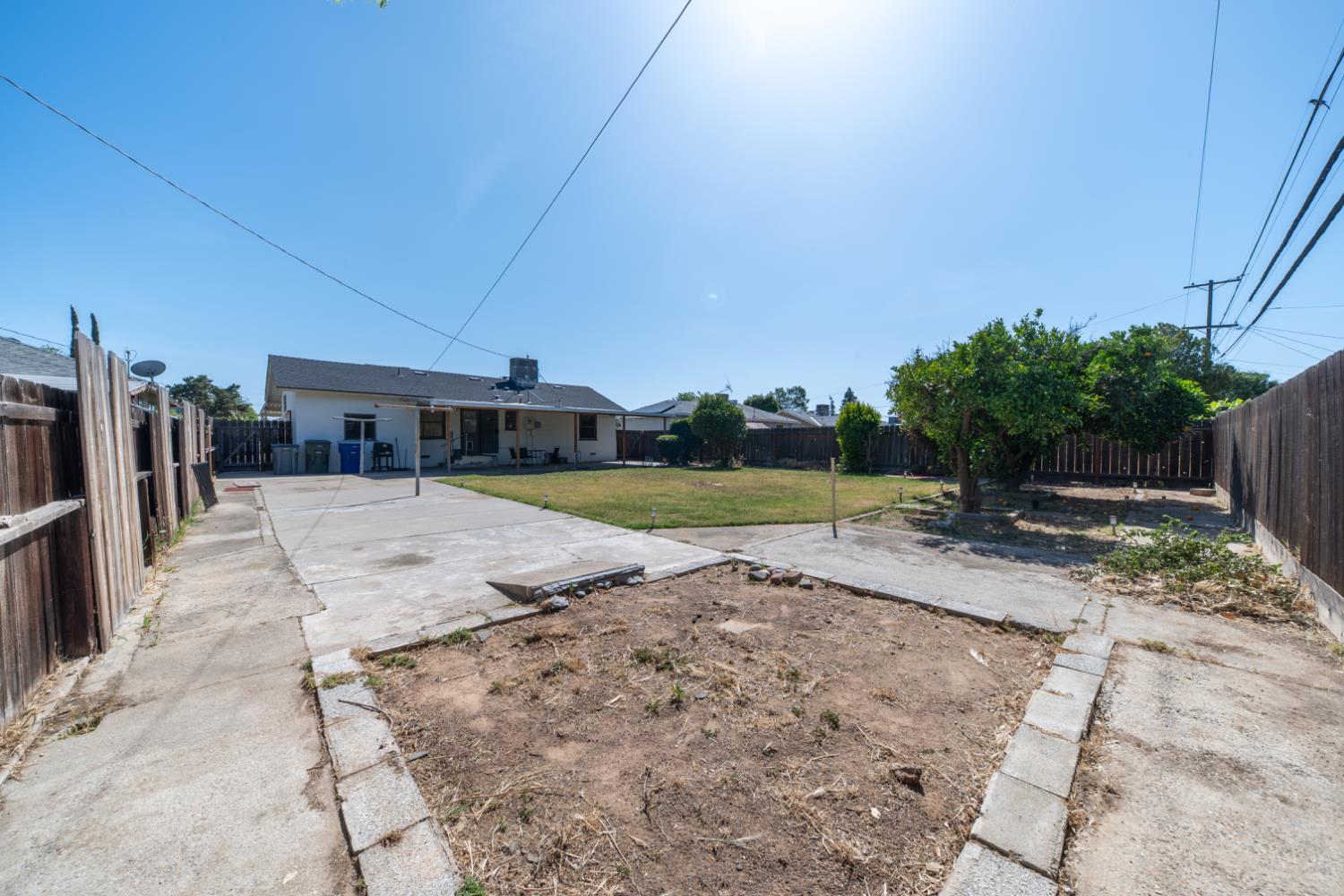 1004 West Pontiac Way Fresno, CA 93705 - Photo 28 of 34 a view of a house with a yard