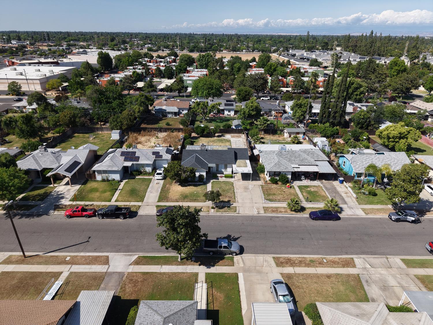1004 West Pontiac Way Fresno, CA 93705 - Photo 32 of 34 an aerial view of multiple houses with a yard
