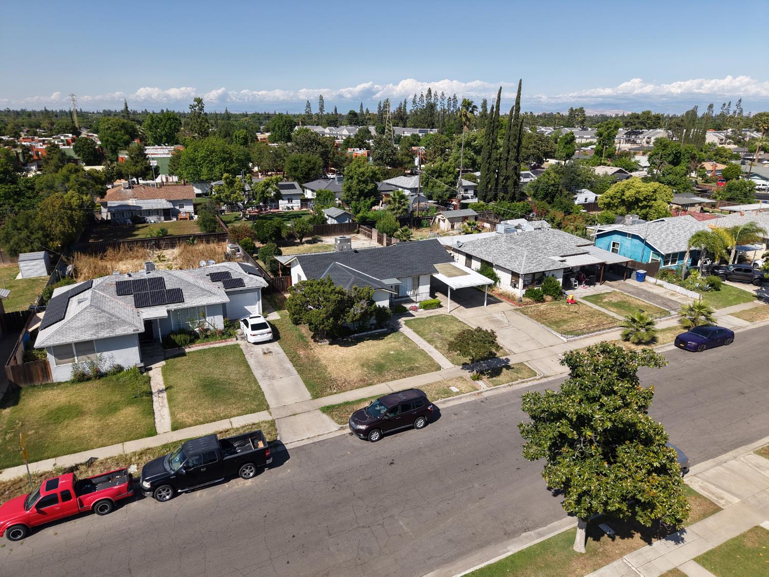 1004 West Pontiac Way Fresno, CA 93705 - Photo 33 of 34 an aerial view of residential houses with outdoor space