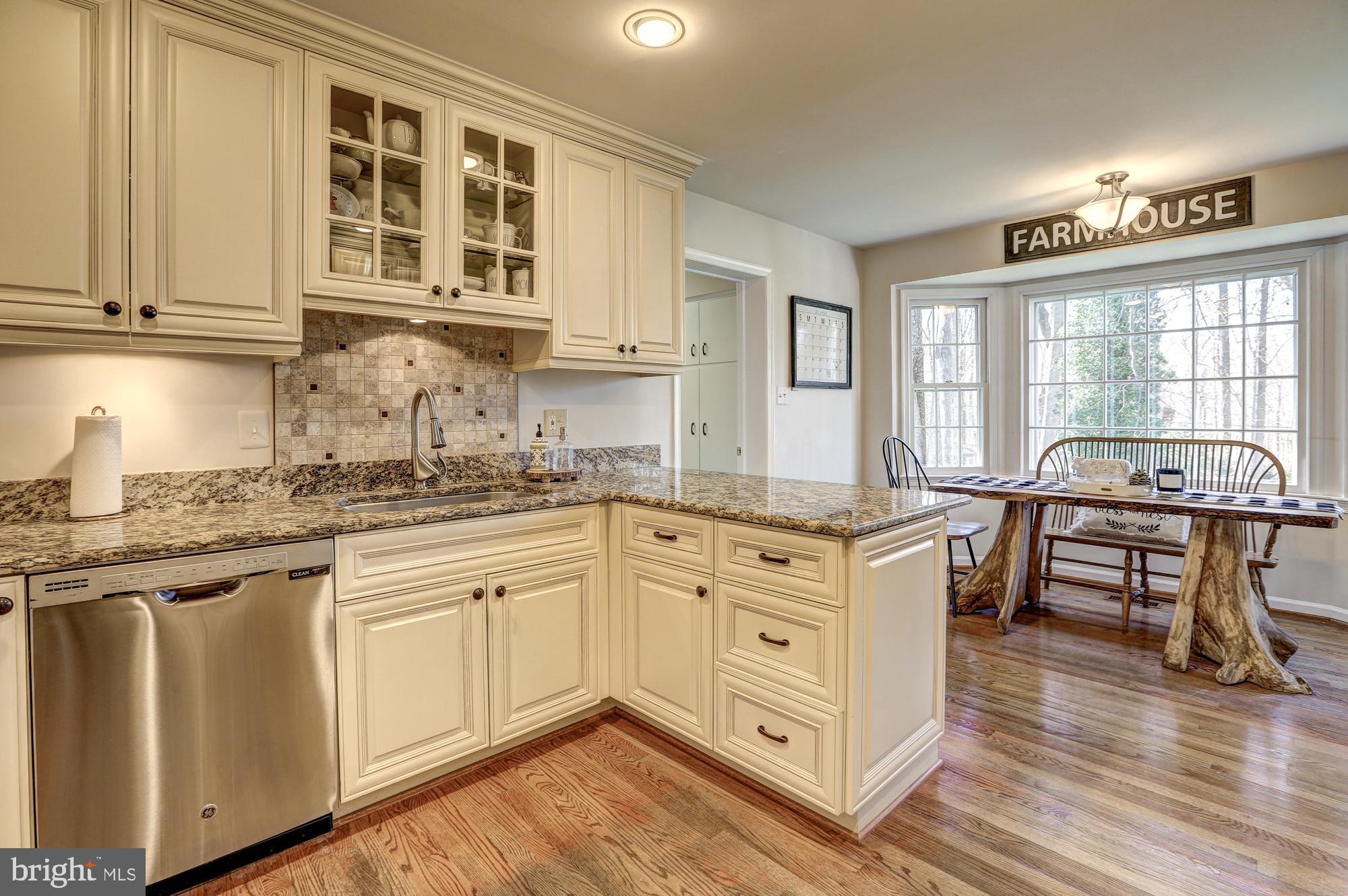 17943 Pond Road Ashton, MD 20861 - Photo 14 of 77 open w/ stainless appliances and stone countertops