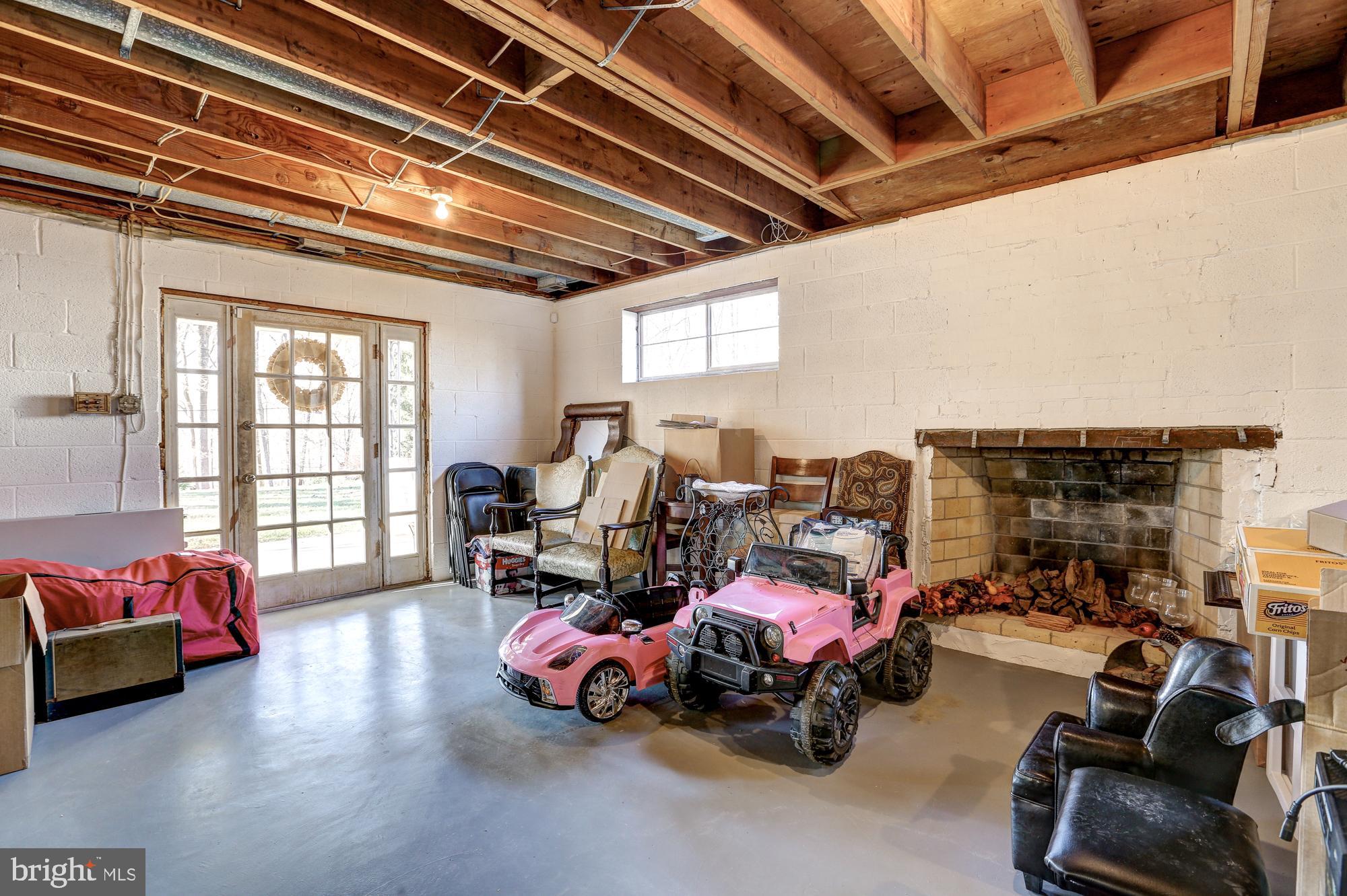 17943 Pond Road Ashton, MD 20861 - Photo 47 of 77 Huge (1200 sf) lower level, fireplace #3