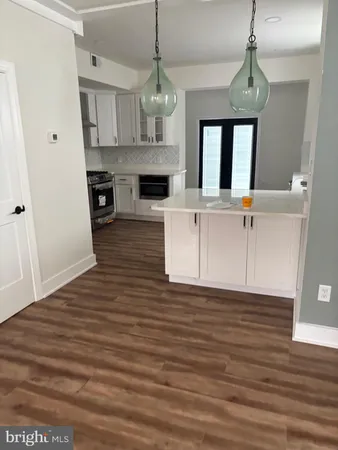 a view of living room with granite countertop furniture and fireplace
