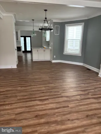 a view of a living room with furniture and window