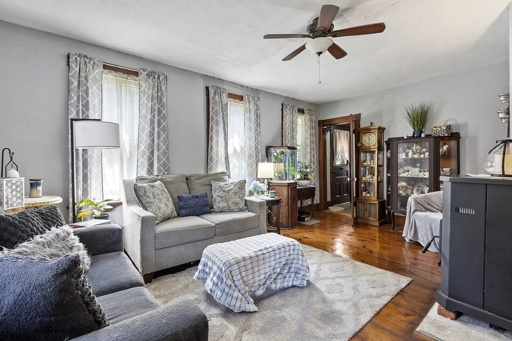 171 South Road Templeton, MA 01436 - Photo 21 of 38 a living room with furniture and a chandelier
