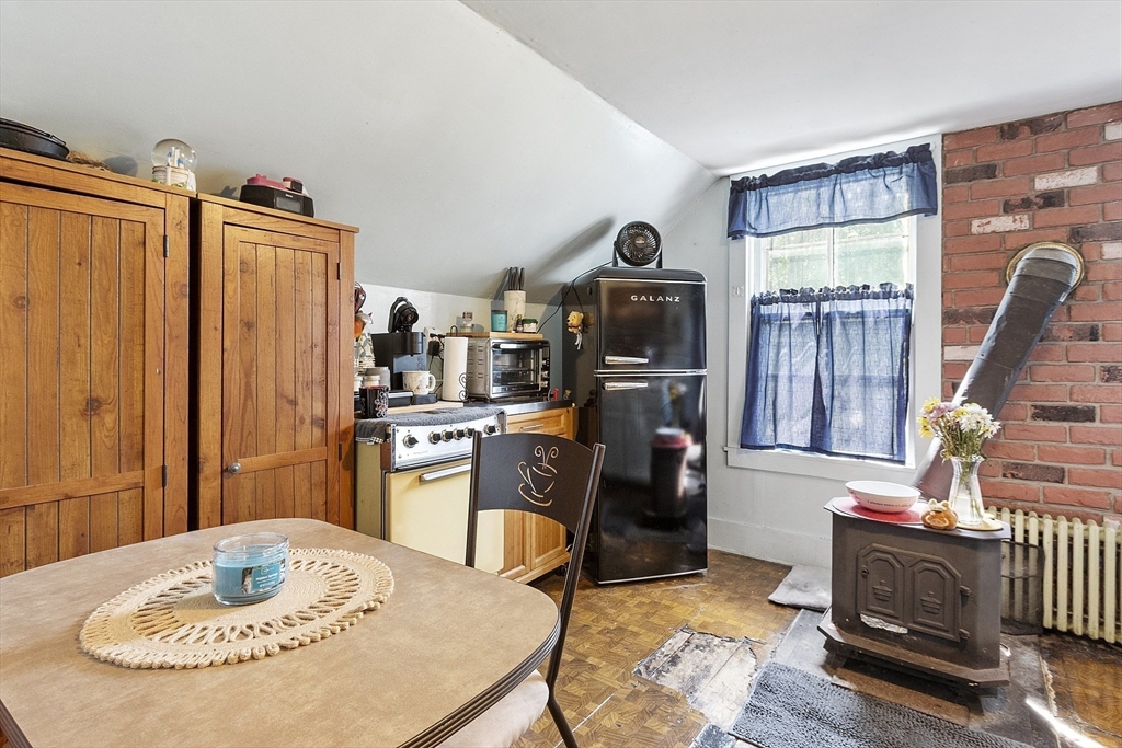 171 South Road Templeton, MA 01436 - Photo 28 of 38 a kitchen with stainless steel appliances granite countertop a table and chairs