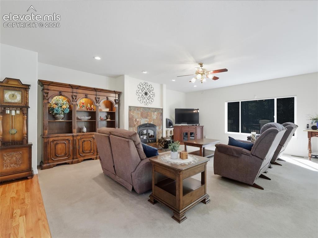 12855 Murphy Road Elbert, CO 80106 - Photo 10 of 50 a living room with furniture and a flat screen tv