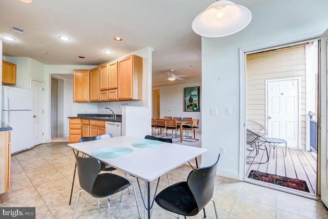 a balcony with table and chairs