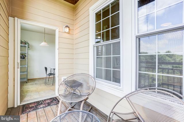 an aerial view of a house with pool table and chairs