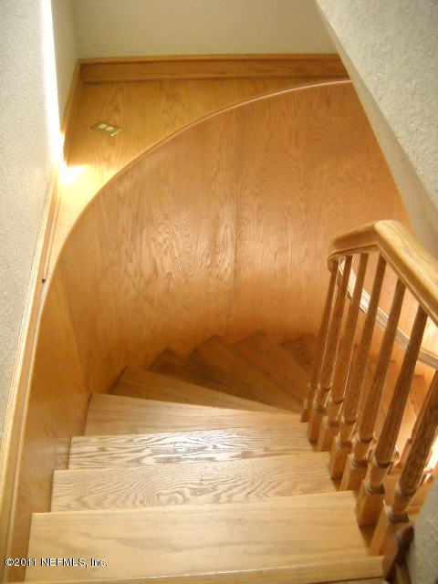 4445 Port Arthur Road Jacksonville, FL 32224 - Photo 23 of 43 Curved Wood Stairway