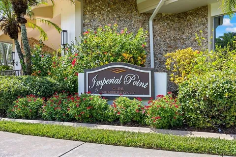 a sign broad in front of flowers