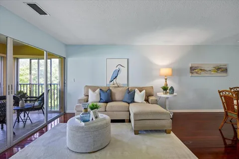 a living room with furniture and a window