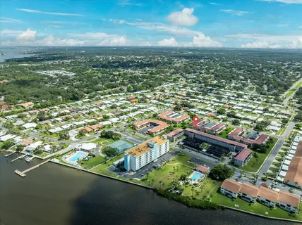 an aerial view of residential houses with outdoor space and street view