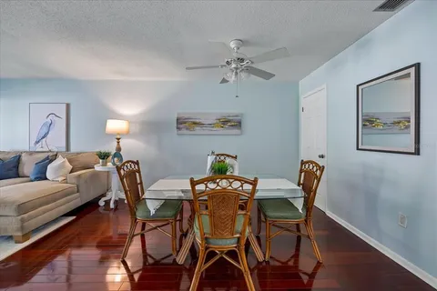 a view of a dining room with furniture and wooden floor