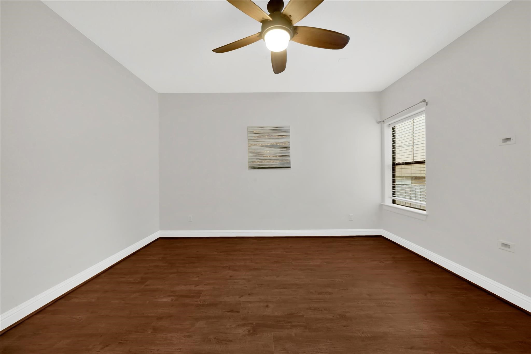 2609 Riverside Drive, Unit C Houston, TX 77004 - Photo 6 of 32 an empty room with wooden floor and windows