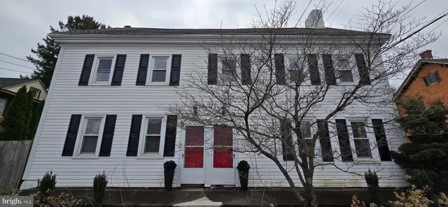 a front view of a house with garage