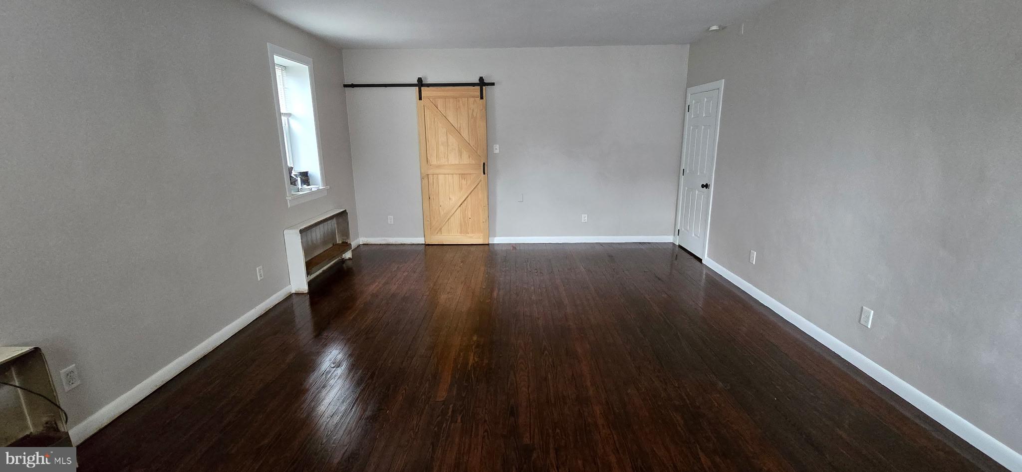 2194 Spinnerstown Road Spinnerstown, PA 18951 - Photo 14 of 27 an empty room with wooden floor and windows