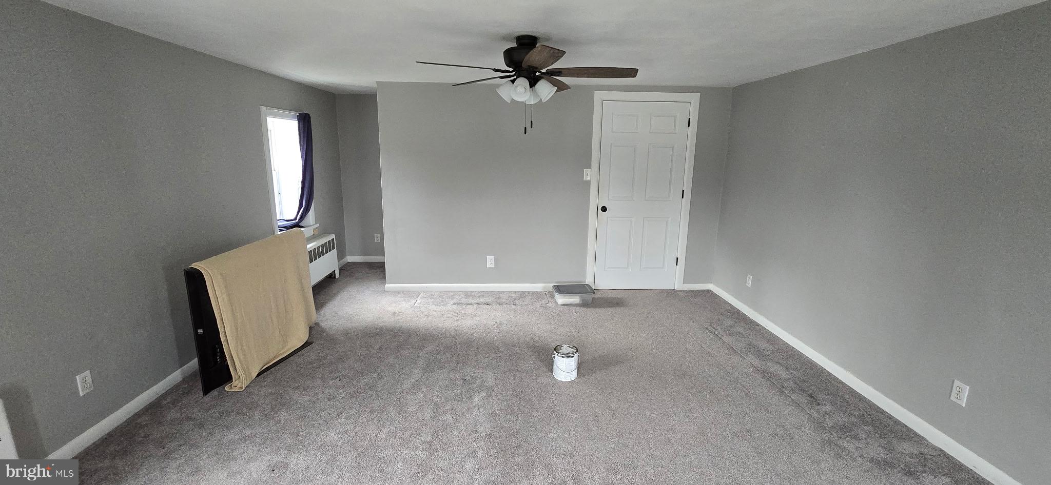 2194 Spinnerstown Road Spinnerstown, PA 18951 - Photo 9 of 27 an empty room with windows and fan