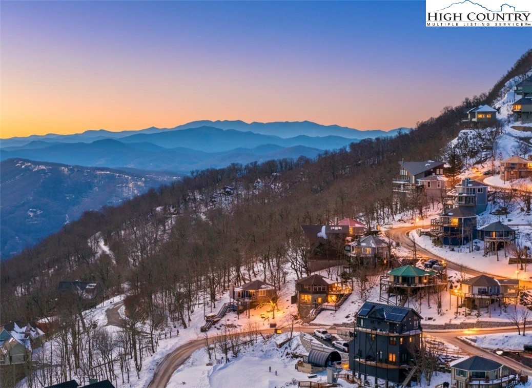 109 Skiloft Road Beech Mountain, NC 28604 - Photo 3 of 30 a view of a city with sunset view