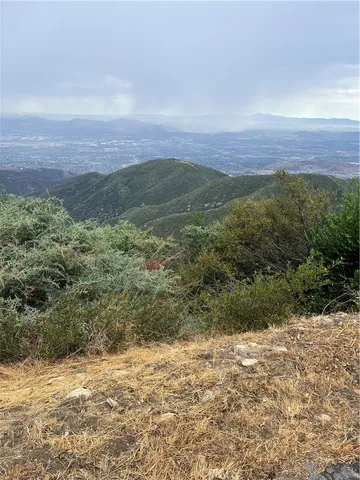 a view of an ocean beach and mountain