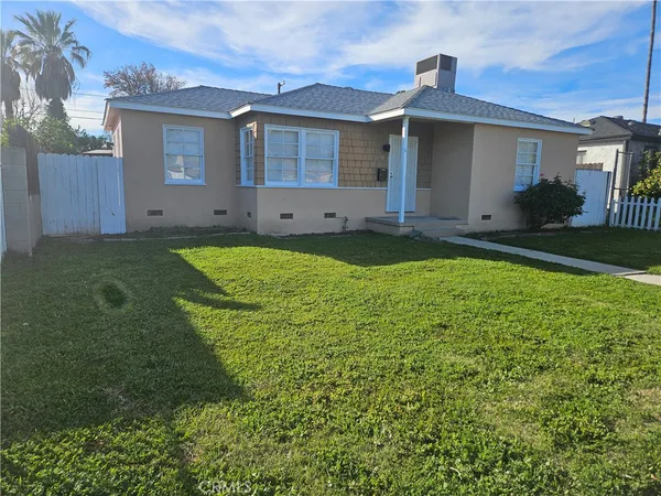 a house view with a garden space