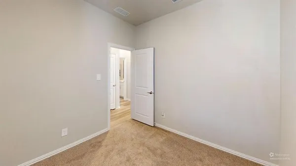 an empty room with a sink