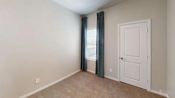 a view of an empty room and window