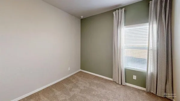 a view of an empty room with a hallway