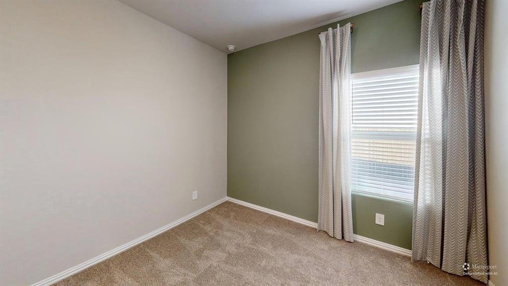 1168 Yucca Avenue Lavon, TX 75166 - Photo 17 of 27 a view of an empty room with a hallway