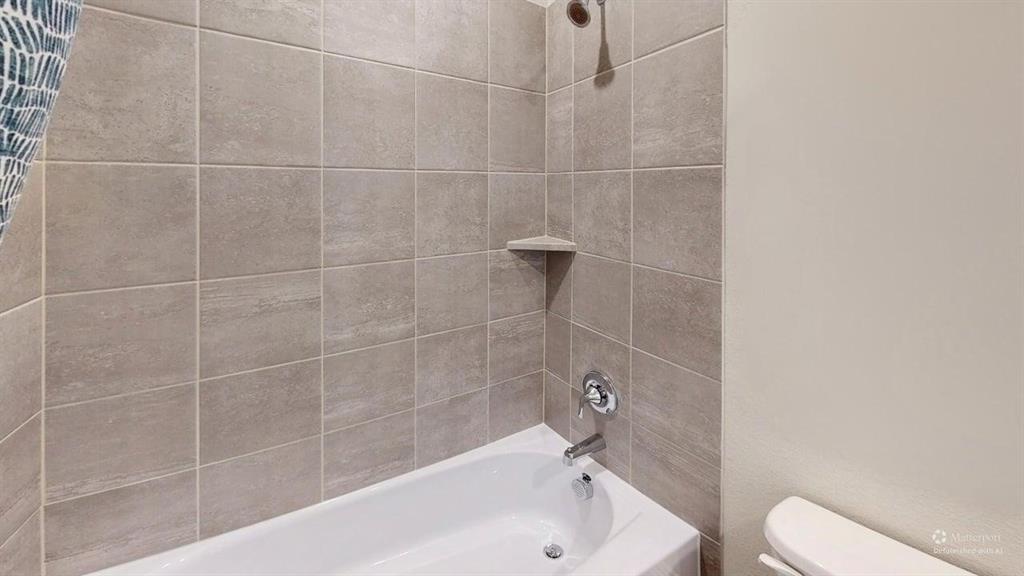 1168 Yucca Avenue Lavon, TX 75166 - Photo 20 of 27 a bathroom with a bathtub and a toilet