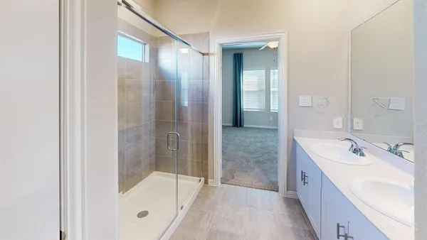 a bathroom with a tub sink and shower