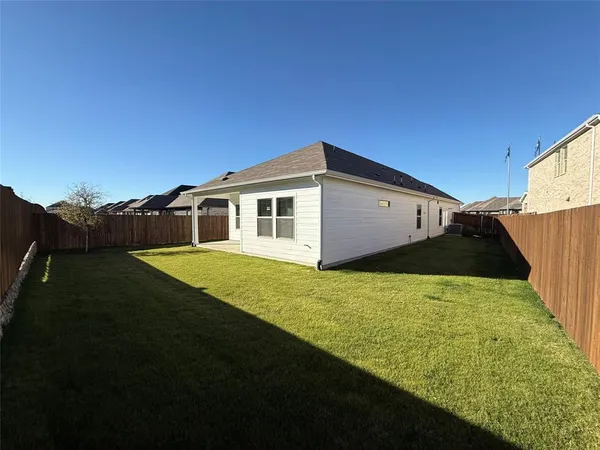 a view of a backyard with plants