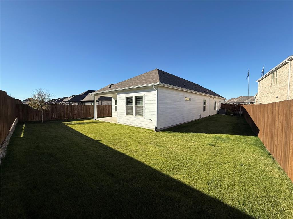 1168 Yucca Avenue Lavon, TX 75166 - Photo 26 of 27 a view of a backyard with plants