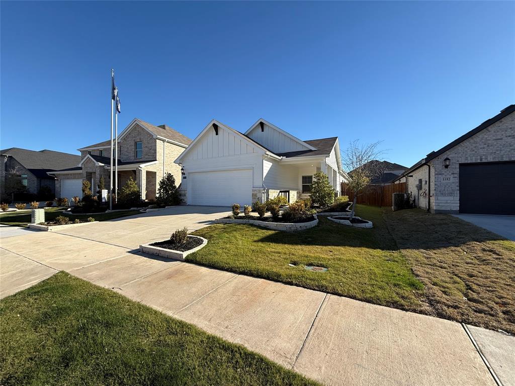 1168 Yucca Avenue Lavon, TX 75166 - Photo 5 of 27 a front view of a house with a yard