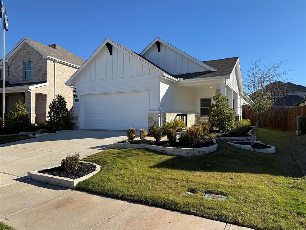 1168 Yucca Avenue Lavon, TX 75166 - Photo 6 of 27 a front view of a house with garden