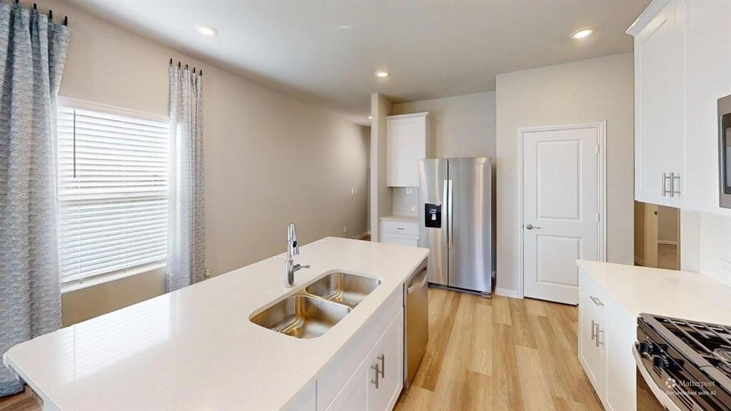 1168 Yucca Avenue Lavon, TX 75166 - Photo 8 of 27 a bathroom with a sink a toilet and shower