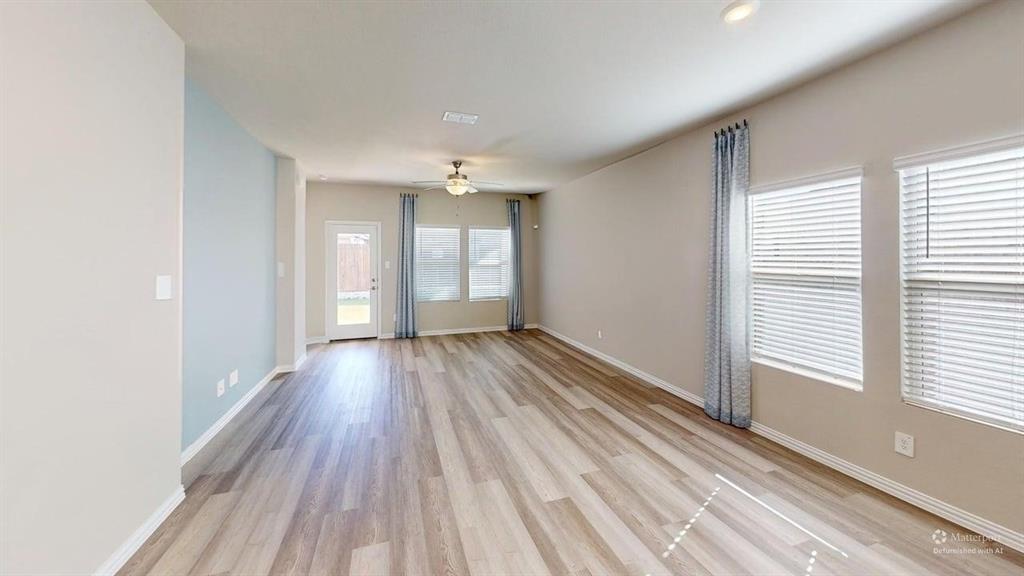 1168 Yucca Avenue Lavon, TX 75166 - Photo 10 of 27 a view of a room with wooden floor and window